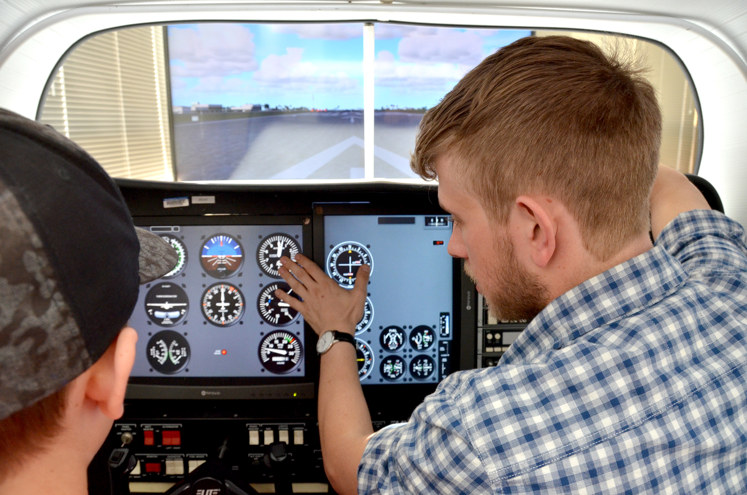 students in the flight simulator